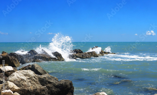 Ioniansea_waves_stones_Italy_Maruggio photo