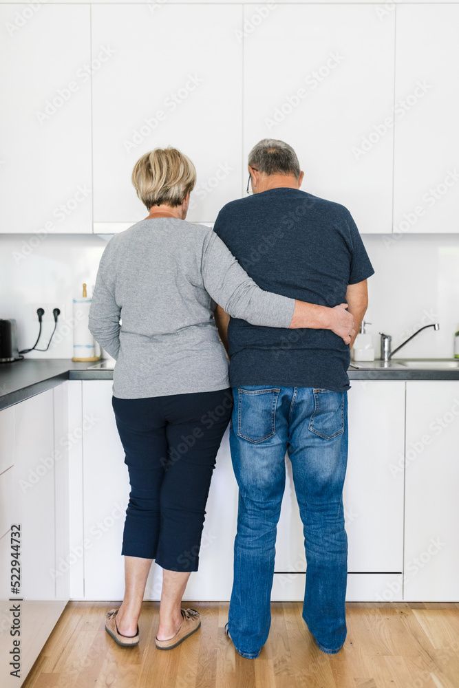 Happy romantic senior couple in love cooking at home Happy romantic senior couple in love cooking at home