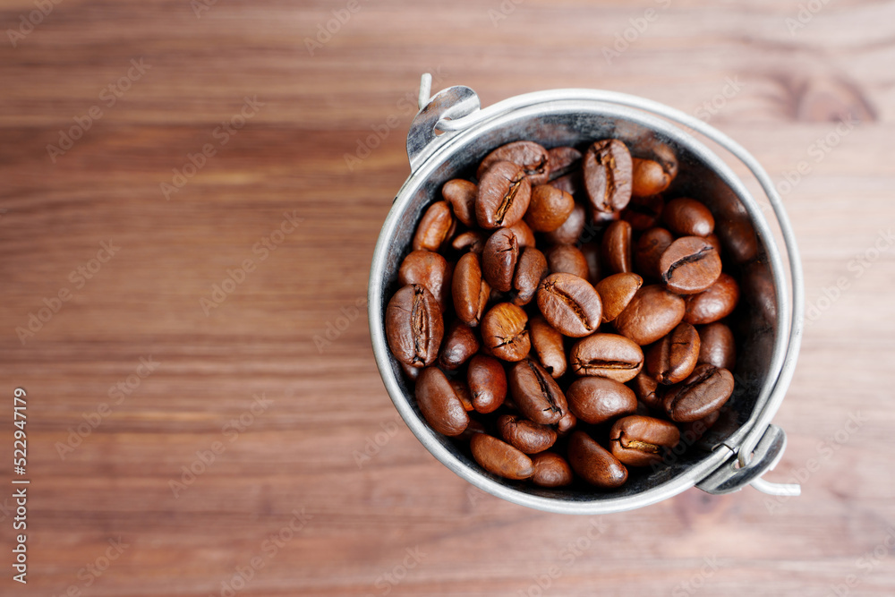 Fototapeta premium Bucket full of roasted coffee beans