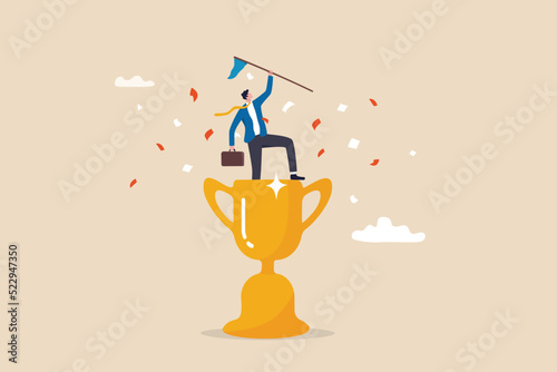Victory or business achievement, triumph or award winning, accomplishment for leadership success, determination for career success concept, cheerful businessman winner raising flag on winning trophy. photo