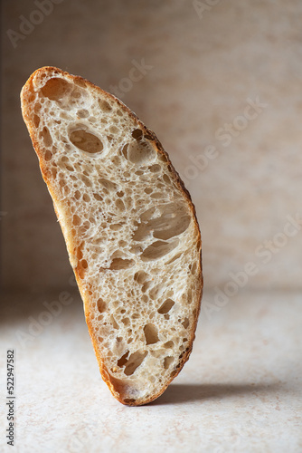Slice of homemade sourdough bread. Close up.