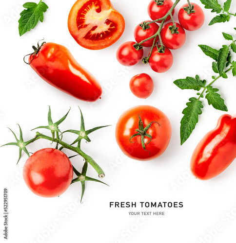 Red tomatoes with leaves on white background.
