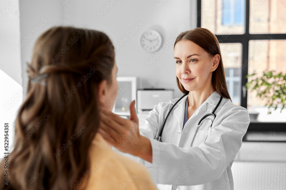medicine, healthcare and people concept - female doctor checking lymph nodes of woman patient at hospital medicine, healthcare and people concept - female doctor checking lymph nodes of woman patient at hospital