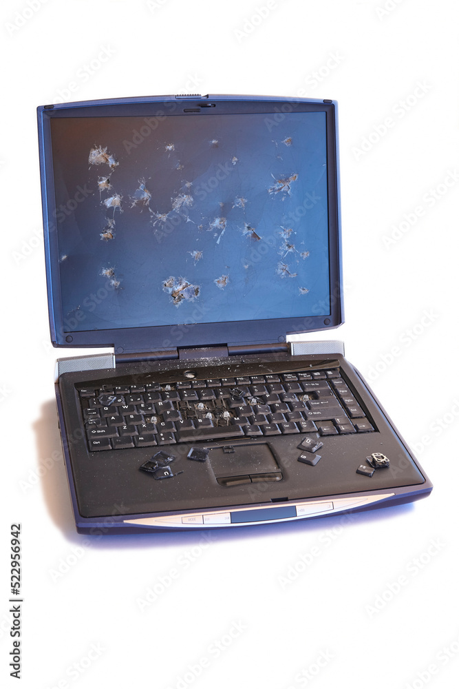 Broken screen and keyboard laptop isolated on white. Accident Broken screen and keyboard laptop isolated on white. Accident