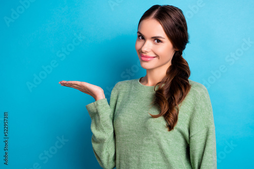 Photo of pretty nice person hand palm hold demonstrate empty space isolated on blue color background