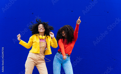 Young happy girls having fun outdoor. Teenagers making different activities in the afternoon after the school