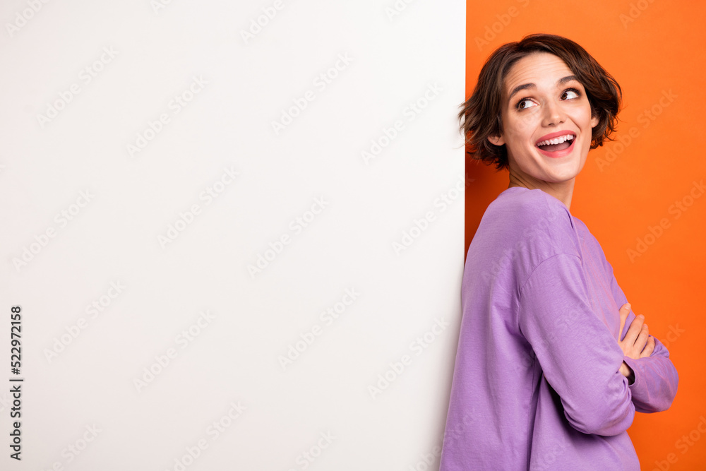 Photo of minded clever person folded hands look empty space brainstorming isolated on orange color background Photo of minded clever person folded hands look empty space brainstorming isolated on orange color background