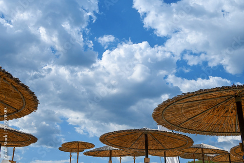 Fototapeta Naklejka Na Ścianę i Meble -  beach umbrellas with blue sky