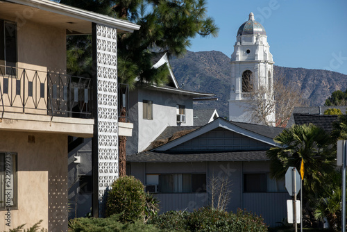 Afternoon view of a historic church and housing in downtown Monrovia, California, USA.