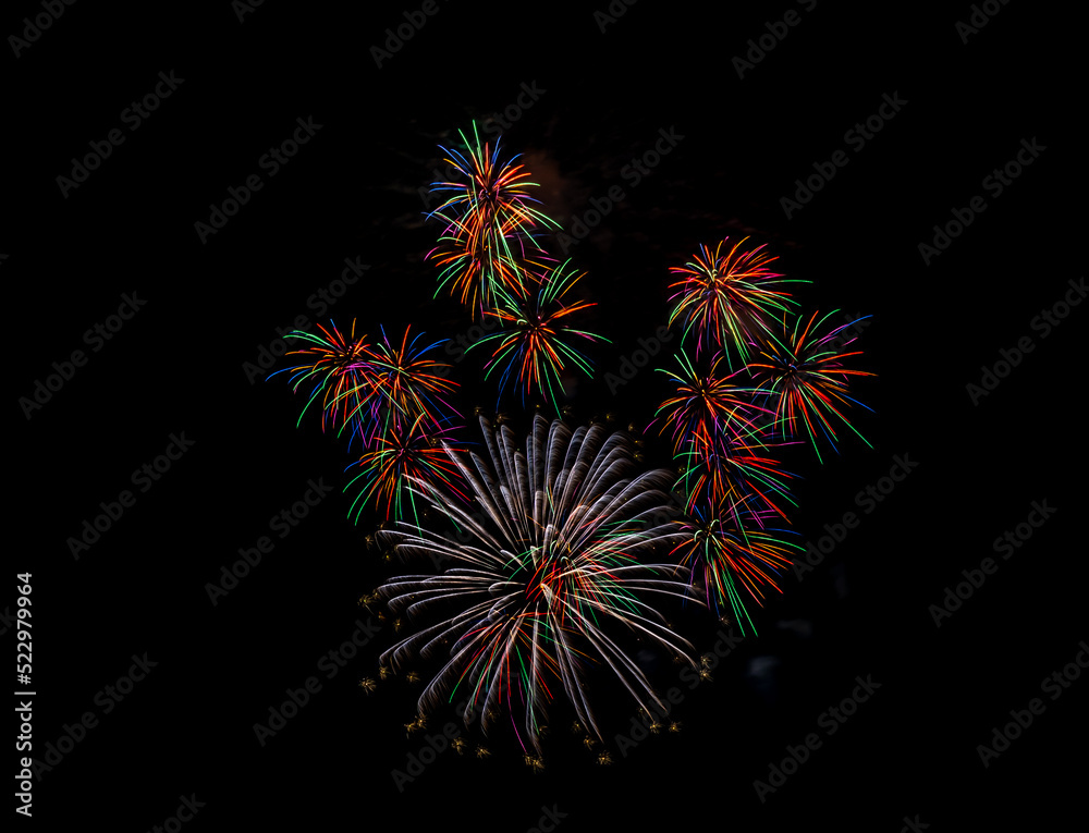 Beautiful colorful fireworks in the sky. International Fireworks. Fireworks are displayed in the dark sky background. Japan festival. Framed Explosion. Cityscape night time