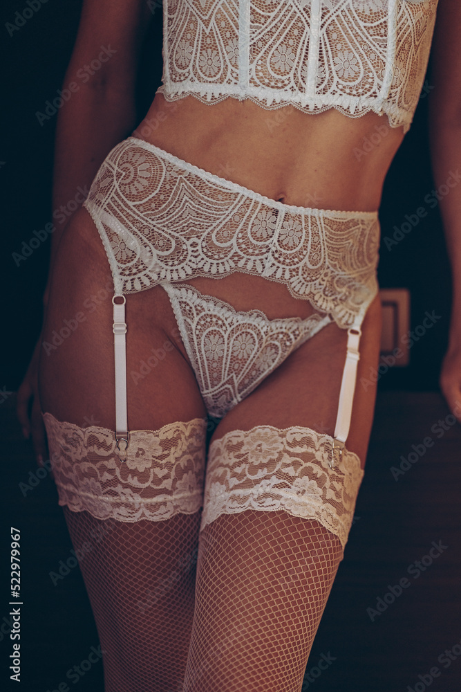Close-up of a seductive woman in sexy lingerie and stockings. Wedding  underwear, stockings, garter belt Stock-Foto | Adobe Stock