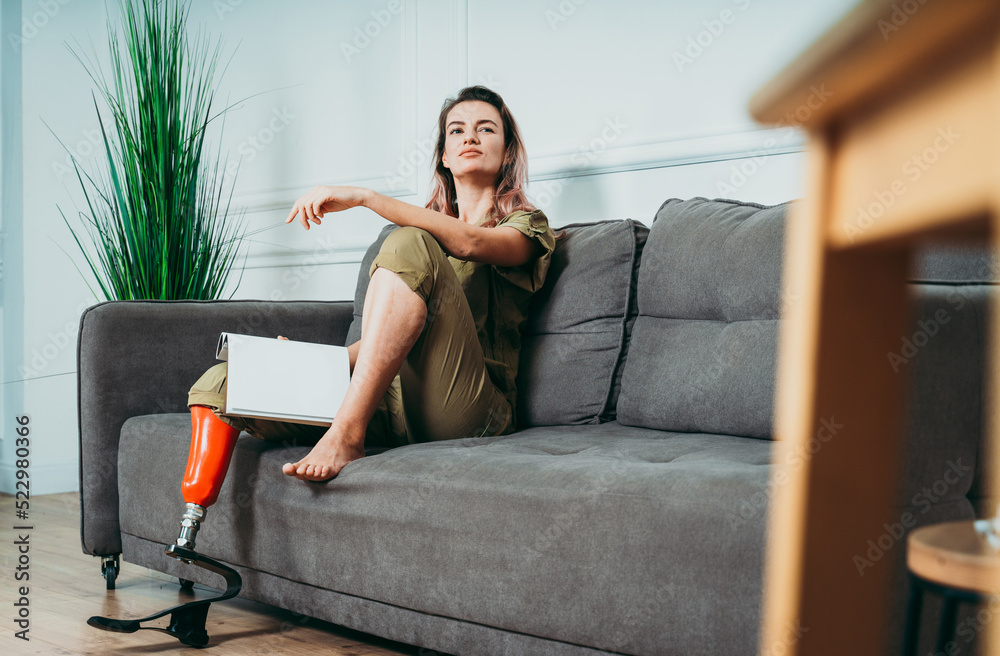 Amputated woman. Cinematic image of a beautiful young woman with leg prosthesis. Amputated woman. Cinematic image of a beautiful young woman with leg prosthesis.