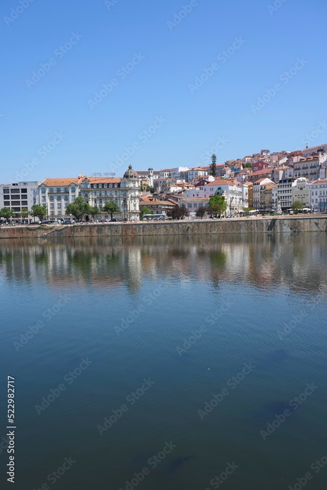 Scenery of Coimbra city and Mondego river in Portugal - vertical