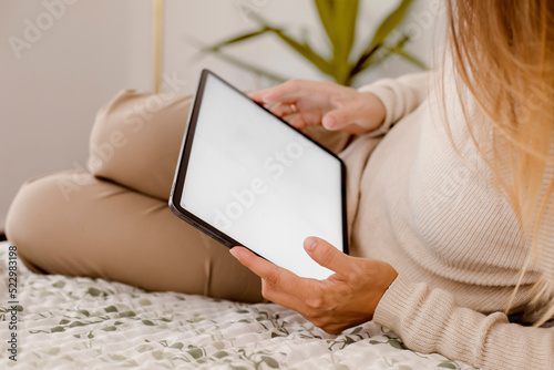 casual woman hold tablet with white screen background at home