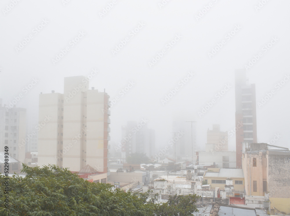city buildings on a very foggy day