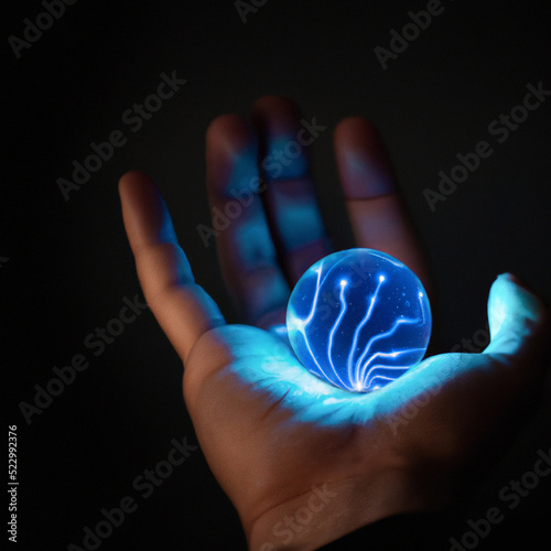Hand Holding Electric Orb