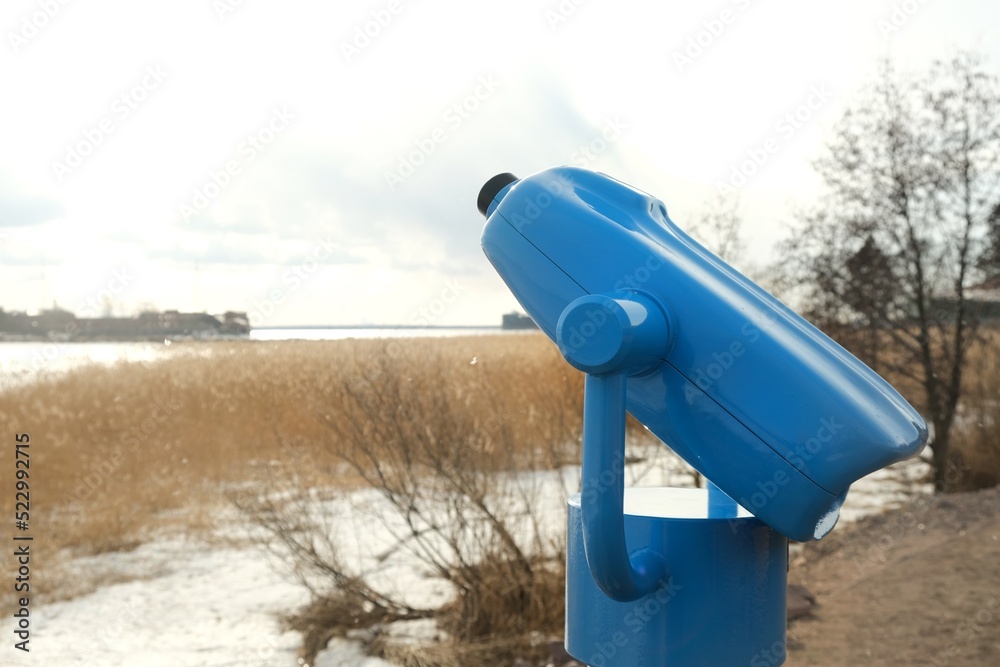 touristic telescope look at the city with view winter landscape , closeup binocular on background viewpoint observe vision, travel nature concept touristic telescope look at the city with view winter landscape , closeup binocular on background viewpoint observe vision, travel nature concept