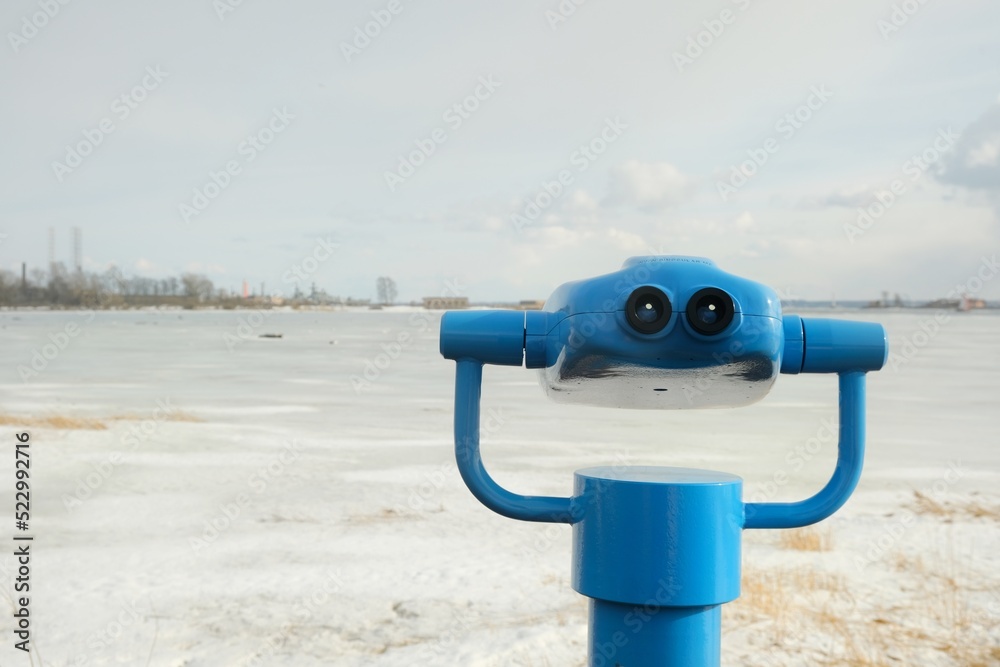 touristic telescope look at the city with view winter landscape , closeup binocular on background viewpoint observe vision, travel nature concept  