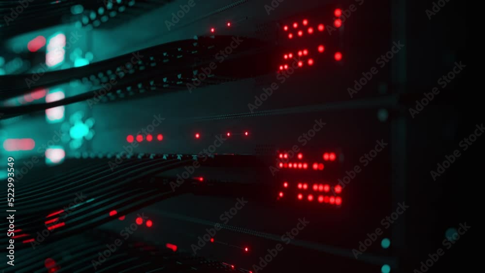 Close-up view of modern internet network switch with plugged ethernet cables. Blinking lights on internet server. Concept of big data center mining. Cloud computing and telecommunications
