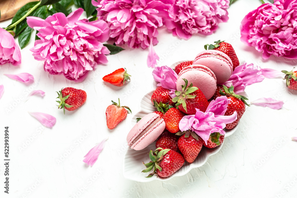 Sweet fresh strawberries with peony rose on a white background. Banner, flyer, beautiful postcard, top view Sweet fresh strawberries with peony rose on a white background. Banner, flyer, beautiful postcard, top view
