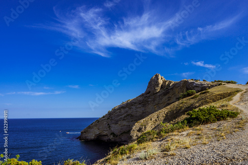 The trail on the cliff. Black sea. Blue sky. Nature of Crimea.