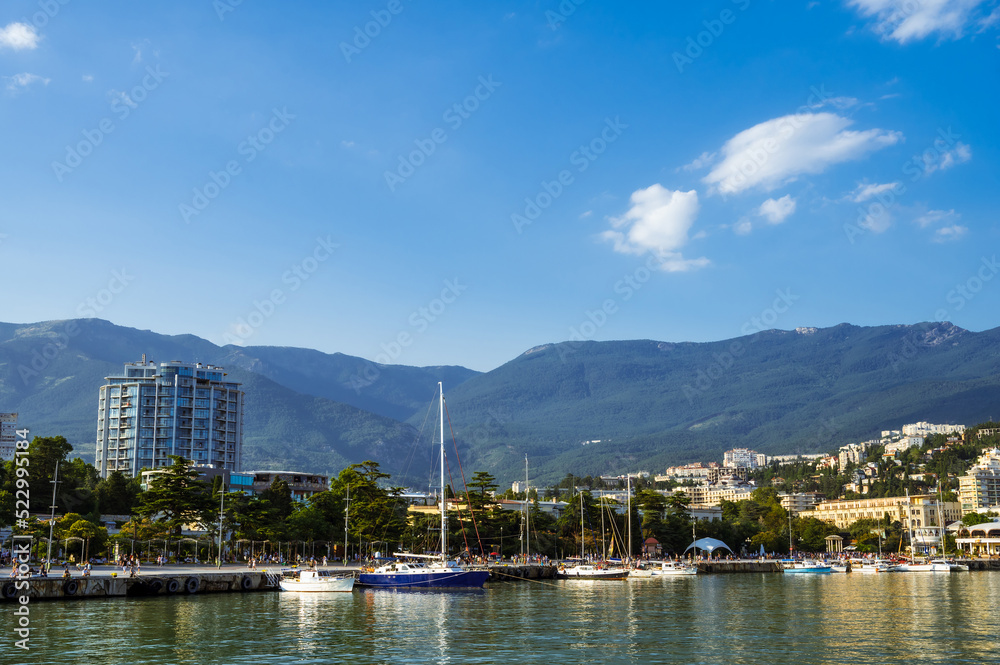 Scenic cityscape of Yalta, Crimea. View from sea. Sunny summer day.