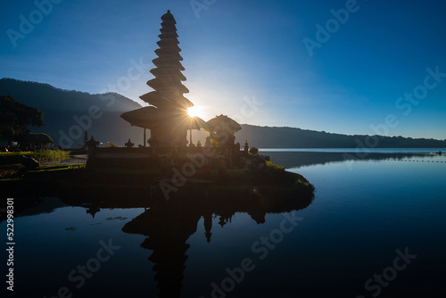 Sunrise at Pura Ulun Danu Bratan, Bali, Indonesia..Ulun Danu Beratan: iconic Temple on Lake Beratan in the Bedugul Highlands..A beautiful scenery of Pura Ulun Danu Bratan at sunrise.