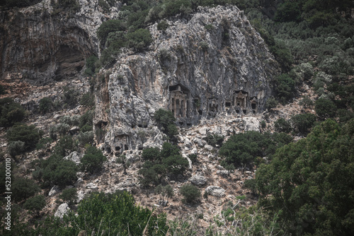 Beautiful Lycian tombs in the rock. Turkish Dalyan. Remains of an ancient civilization. Ancient architecture in the rock. Beautiful mountains.