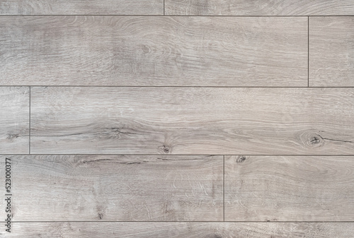 Classic laminate flooring pattern. The texture is clearly visible.