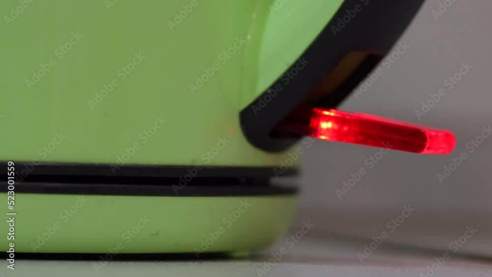 Male Finger Pressing Button On Electric Kettle For Boiling Water. The Kettle Boils And Turns Off. 60 FPS, 4k, ProRes Male Finger Pressing Button On Electric Kettle For Boiling Water. The Kettle Boils And Turns Off. 60 FPS, 4k, ProRes