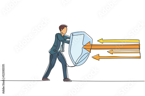 Continuous one line drawing of young handsome male worker holding arrows attack using shield. Success defensive strategy minimalist concept. Trendy single line draw design vector graphic illustration