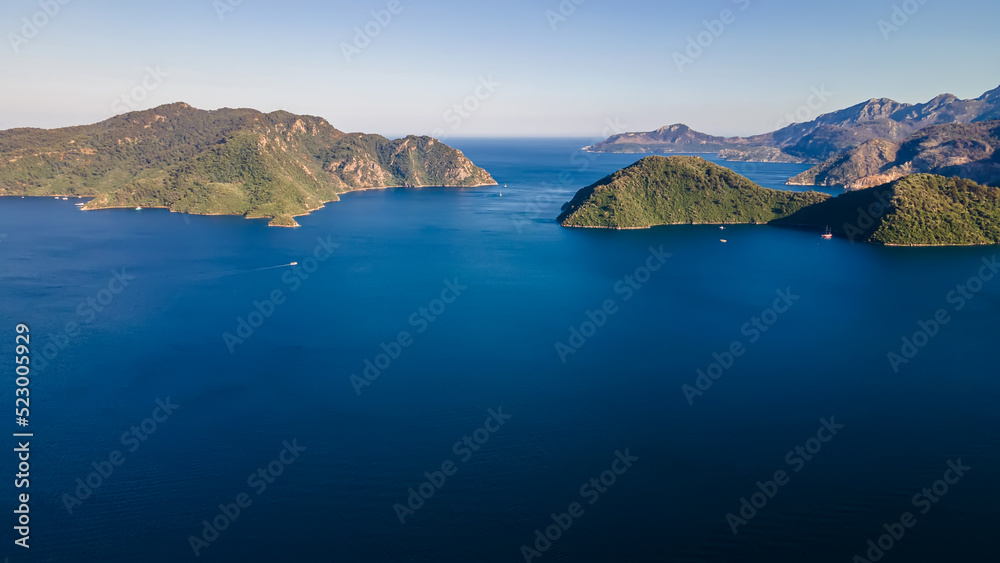 Fototapeta premium Beautiful evening sunset on the sea. Sea islands. Beautiful and colorful nature. Beautiful bays on the sea. Sea evening.