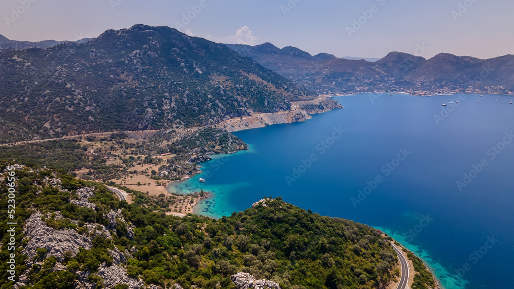 Beautiful seashore. Islands in the distance. Colorful blue sea. The beauty of Turkey. Beautiful rocks and mountains. Sunny clear day. Beautiful water.