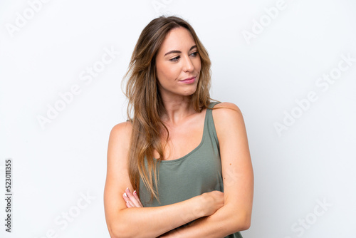 Young caucasian woman isolated on white background looking to the side