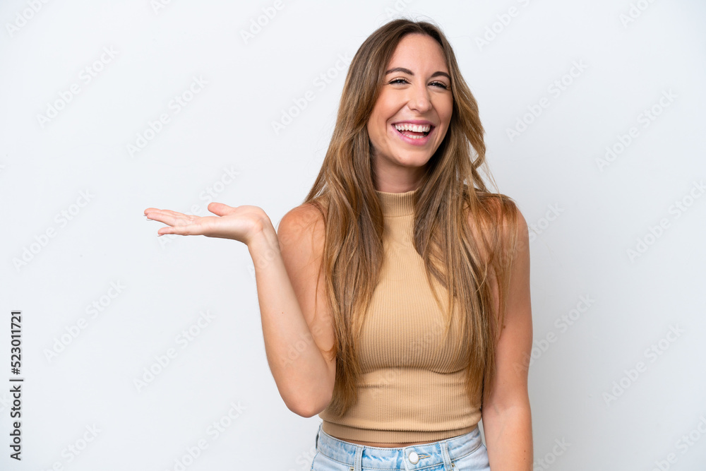 Young caucasian woman isolated on white background holding copyspace imaginary on the palm to insert an ad Young caucasian woman isolated on white background holding copyspace imaginary on the palm to insert an ad