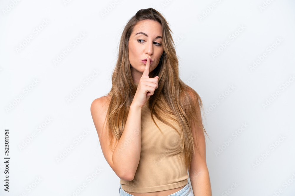 Young caucasian woman isolated on white background showing a sign of silence gesture putting finger in mouth Young caucasian woman isolated on white background showing a sign of silence gesture putting finger in mouth