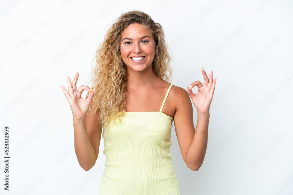 Girl with curly hair isolated on white background showing ok sign with two hands Girl with curly hair isolated on white background showing ok sign with two hands