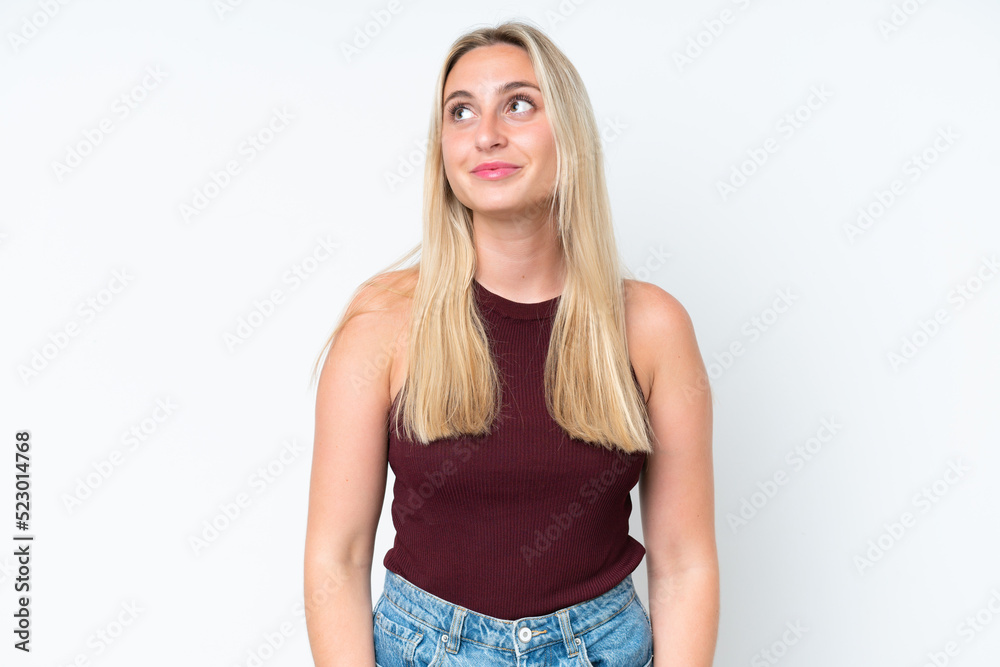 Young caucasian woman isolated on white background thinking an idea while looking up