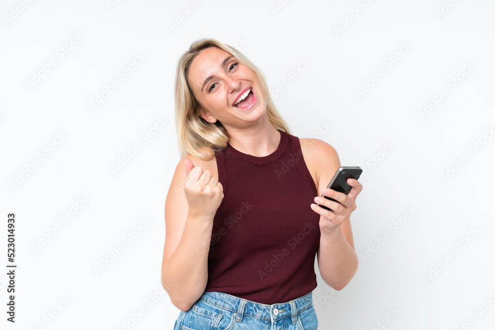 Young caucasian woman isolated on white background with phone in victory position Young caucasian woman isolated on white background with phone in victory position
