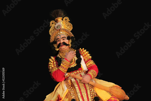 Senior Yakshagana artist showing  happiness in very rare instance in a photoshoot photo