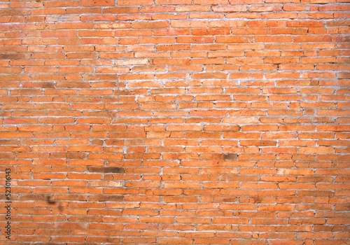 The empty red bricks line the structure of the
building. The nature of the arrangement that is
different from the usual is a messy arrangement.
look like another art. red, orange,brick,design,wall