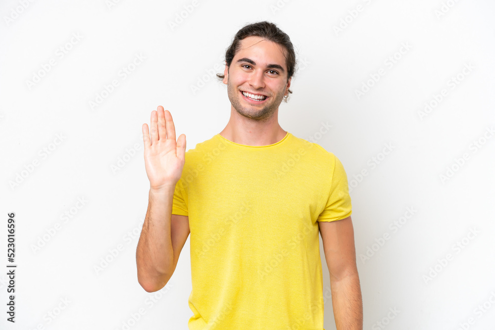 Caucasian handsome man isolated on white background saluting with hand with happy expression Caucasian handsome man isolated on white background saluting with hand with happy expression