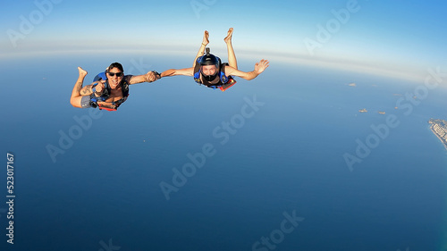 Skydiving in the Rio de Janeiro. A summer day, shirtless on the beach. photo