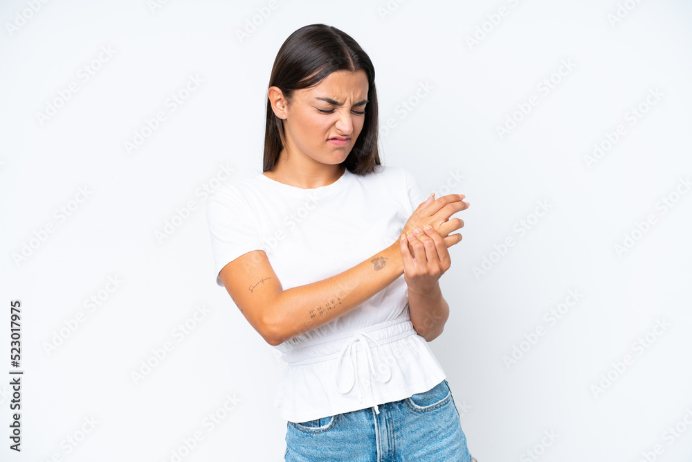 Young caucasian woman isolated on white background suffering from pain in hands Young caucasian woman isolated on white background suffering from pain in hands