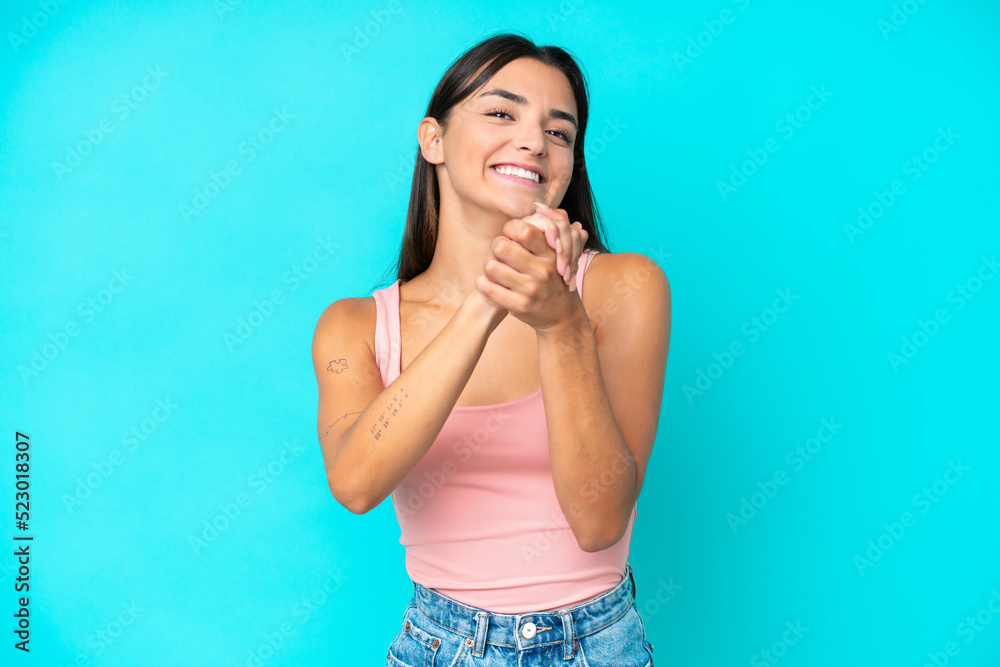 Young caucasian woman isolated on blue background laughing Young caucasian woman isolated on blue background laughing