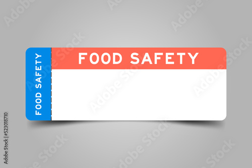 Blue and orange color ticket with word food safety and white copy psace on gray background
