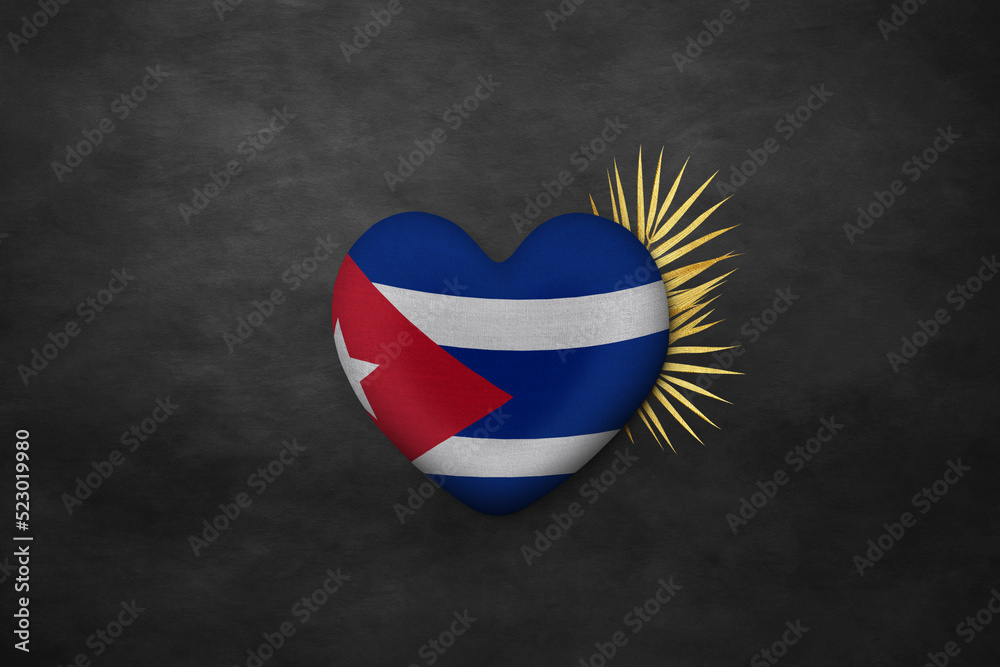 Naklejka premium Textile heart in colors of national flag. Photography and marketing digital backdrop. Cuba