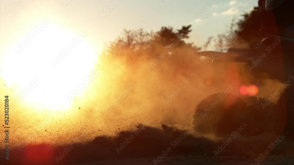 Super Slow Motion of Spinning Wheel of Quad Biker in Sunset. Filmed on High Speed Cinema Camera, 1000 fps. Super Slow Motion of Spinning Wheel of Quad Biker in Sunset. Filmed on High Speed Cinema Camera, 1000 fps.