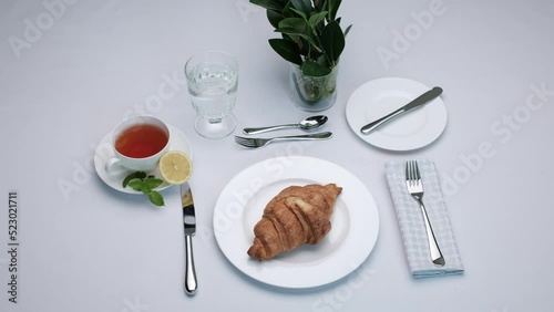 Classic serving tableware on the table, white plate fork and knife