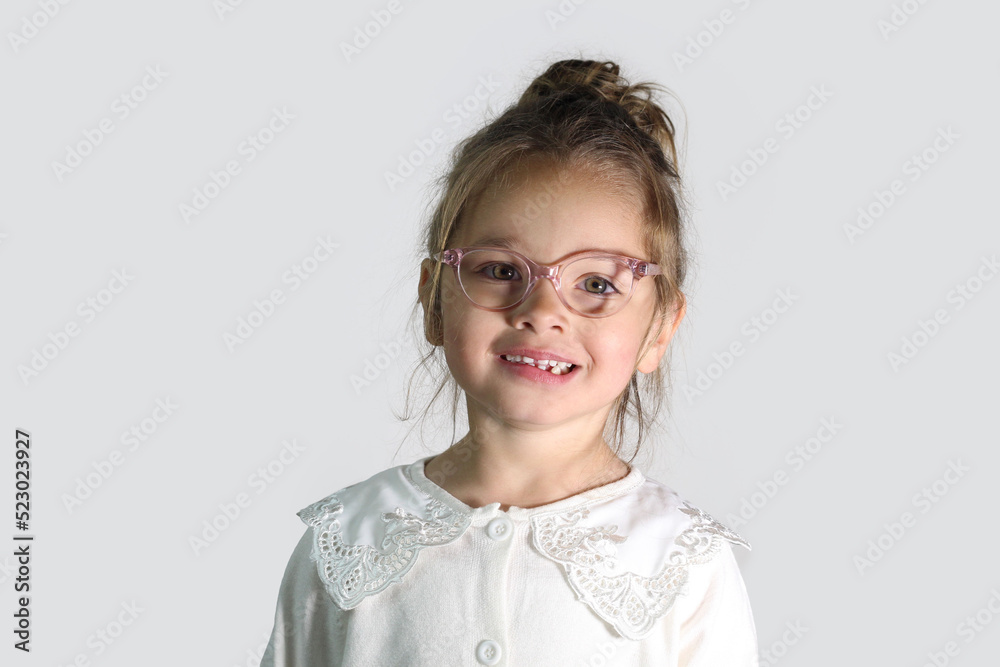Little caucasian Girl Wearing Eye Glasses posing on white background. optician concept Little caucasian Girl Wearing Eye Glasses posing on white background. optician concept